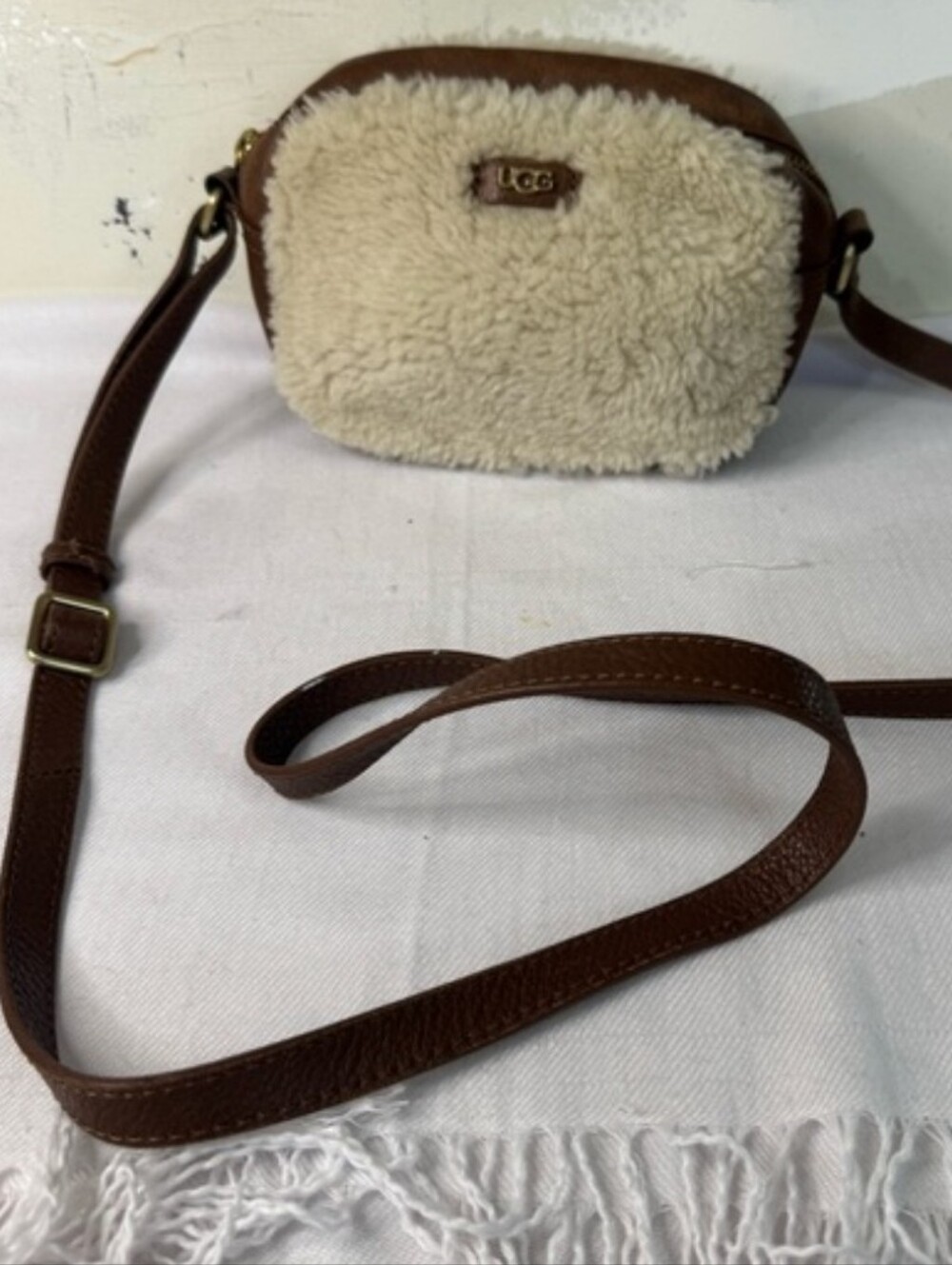 UGG Claire crossbody bag in a beige shearling and brown leather
